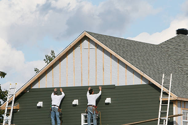Professional Siding technician working in Barton, OH